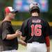 Milan High School head coach Adam Gilles chats with freshman Zachary Allen during a break in the action in the seventh inning of the MHSAA baseball quarterfinals against Coldwater High School at Nichols Field at Bailey Park in Battle Creek on Tuesday, June 11, 2013. Melanie Maxwell | AnnArbor.com